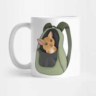 Kitty in a backpack (fluffy orange cat) Mug
